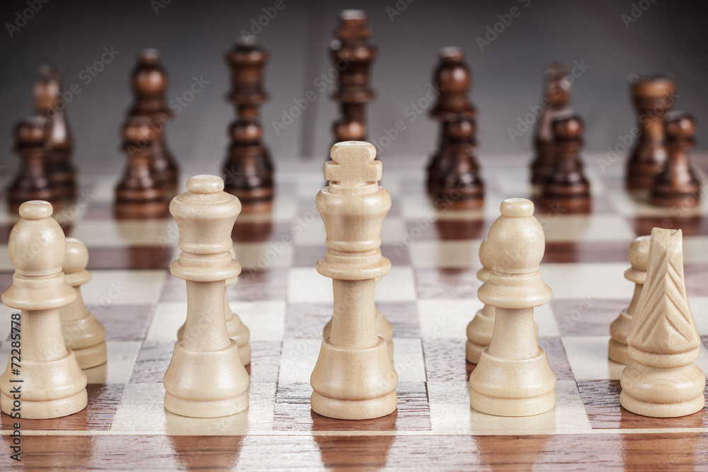 chess board with figures on the wooden table chess board with figures on the wooden table