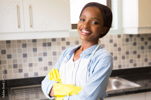 african woman standing in the kitchen photo