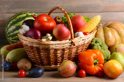 Fototapeta Naklejka Na Ścianę i Meble -  Fresh organic fruits and vegetables on wooden background