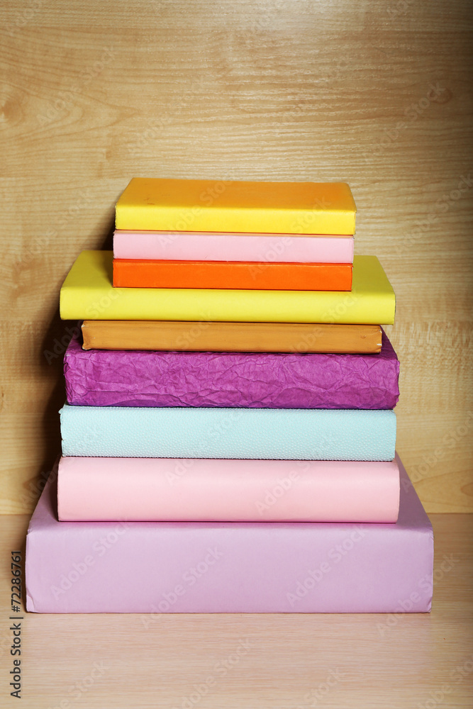 Books on wooden shelf close-up