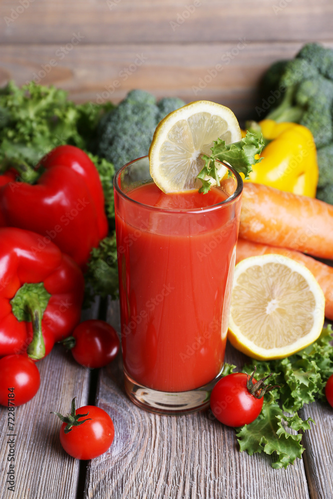 Tomato juice in glass and fresh vegetables Tomato juice in glass and fresh vegetables