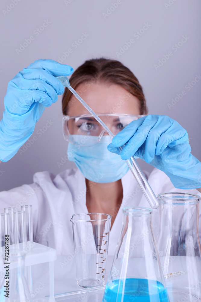 Laboratory assistant making medical test in laboratory Laboratory assistant making medical test in laboratory