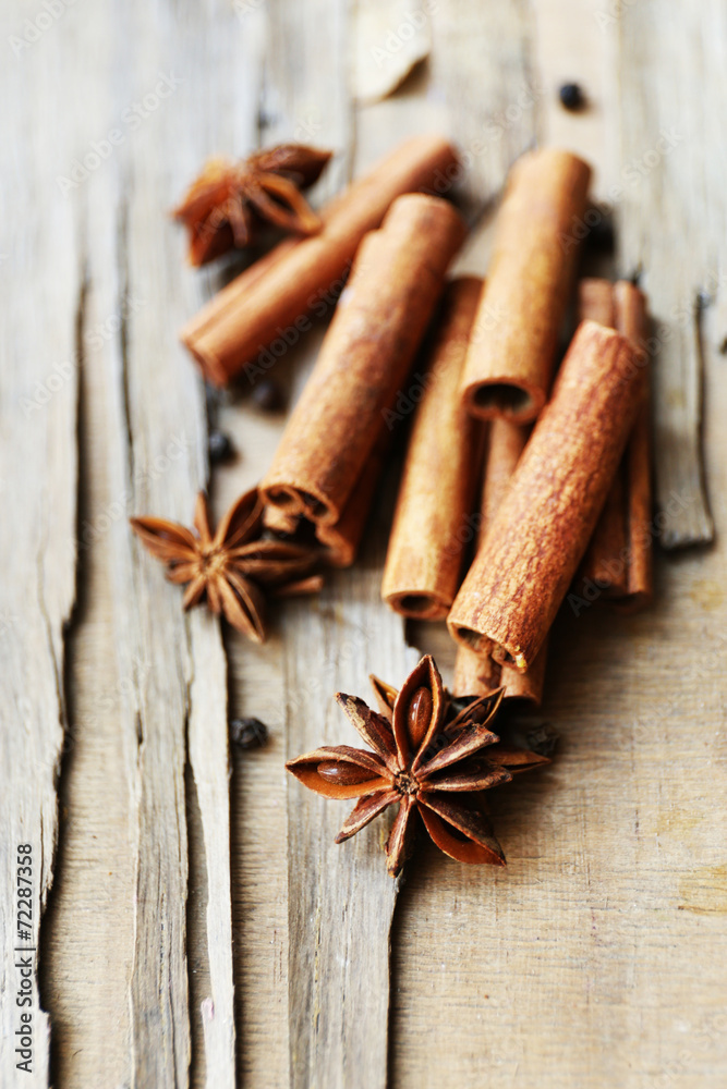 Star anise and cinnamon on wooden background, close-up Star anise and cinnamon on wooden background, close-up