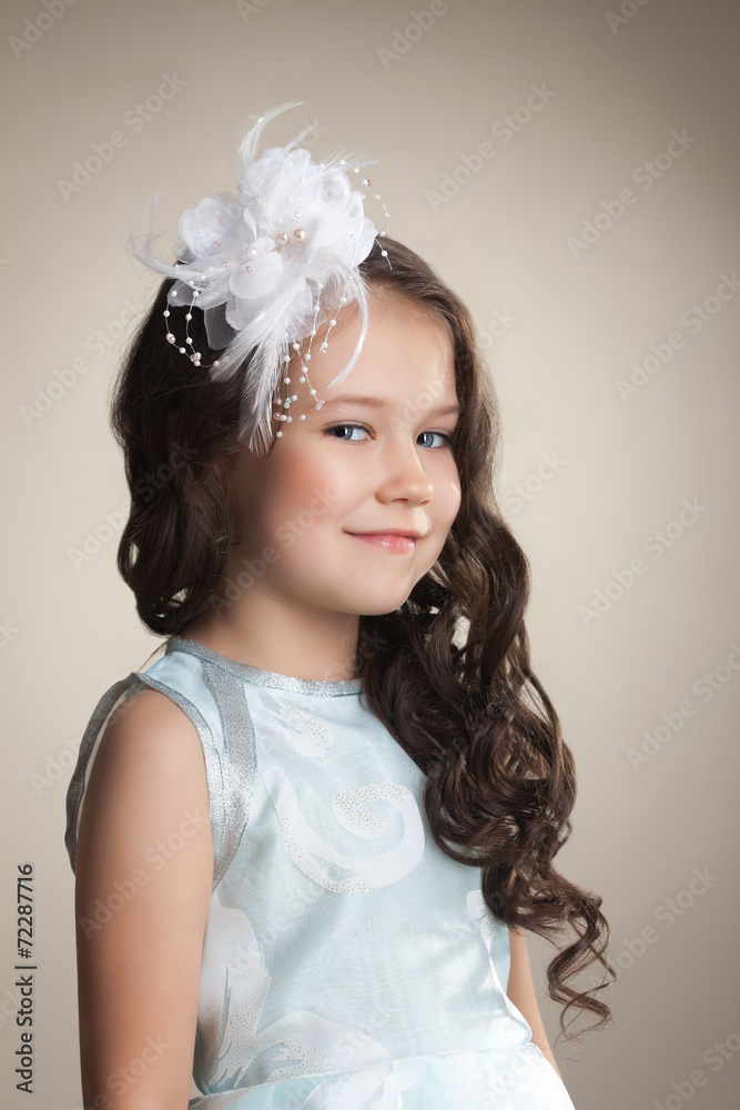 Cute little brunette with decoration in her hair