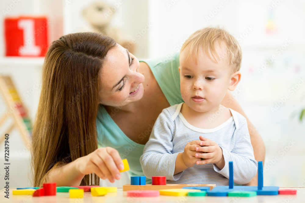little boy and mother with building blocks little boy and mother with building blocks