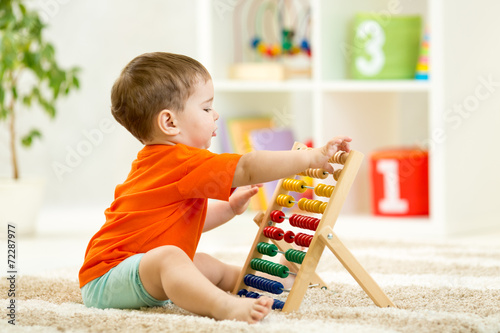 child boy playing with counter