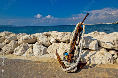 Old rusty anchor by the sea