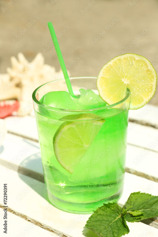 Refreshing cocktail on table, outdoors