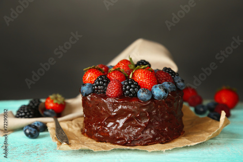 Tasty chocolate cake with different berries