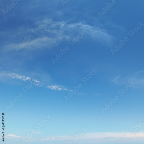 light clouds on a blue sky background © alinamd
