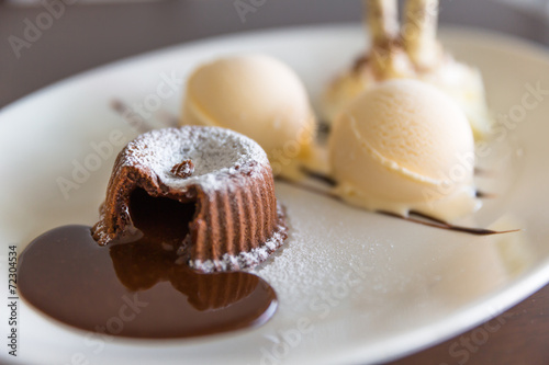 chocolate lava cake set with ice cream on white plate