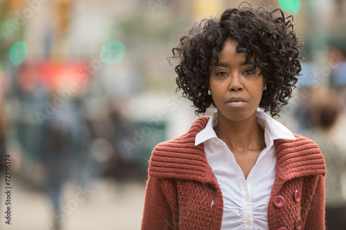 African American black woman in city serious face