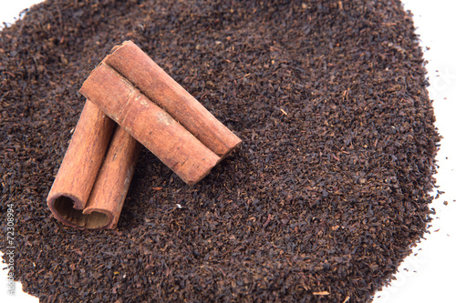 Cinnamon stick on dried and processed tea leaves