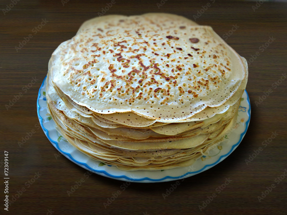 a pile of freshly cooked pancakes on a plate