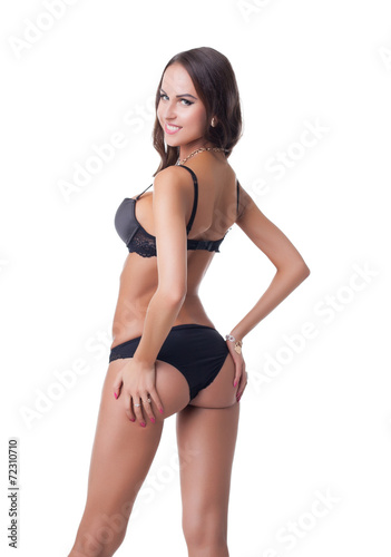Enticing lingerie model posing at camera