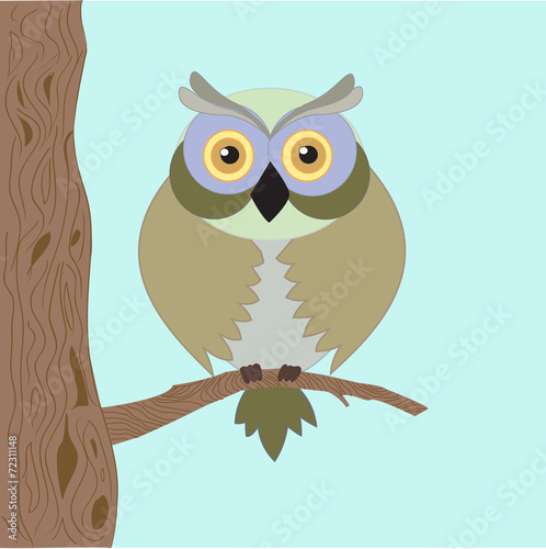 The wise old owl with yellow eyes , sitting lonely on the tree
