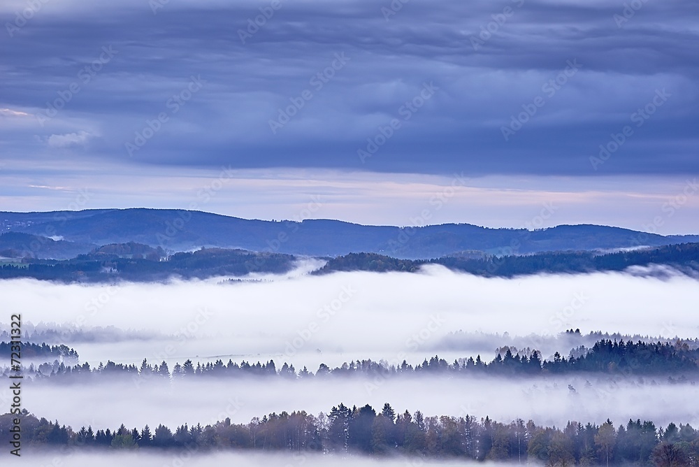 Fototapeta premium Hilly landscape with fog