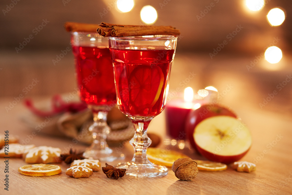 Two glasses of mulled wine with orange and spices Two glasses of mulled wine with orange and spices