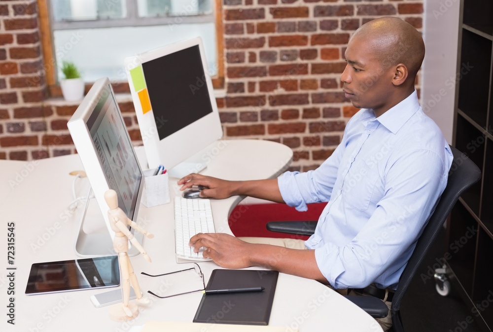 Businessman using computer in office Businessman using computer in office