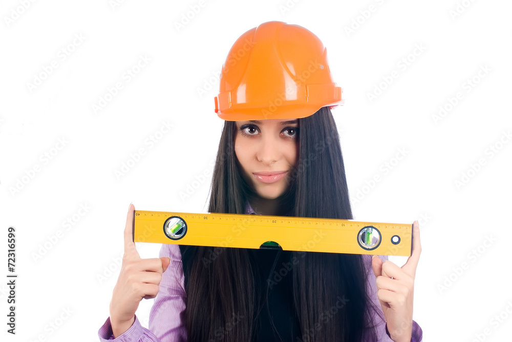 Attractive girl in helmet with level Attractive girl in helmet with level