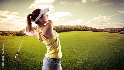 Woman practising golf exercise over beautiful landscape