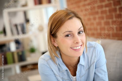 Portrait of charming young woman at home