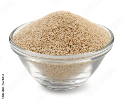 Dry yeast granules in glass bowl