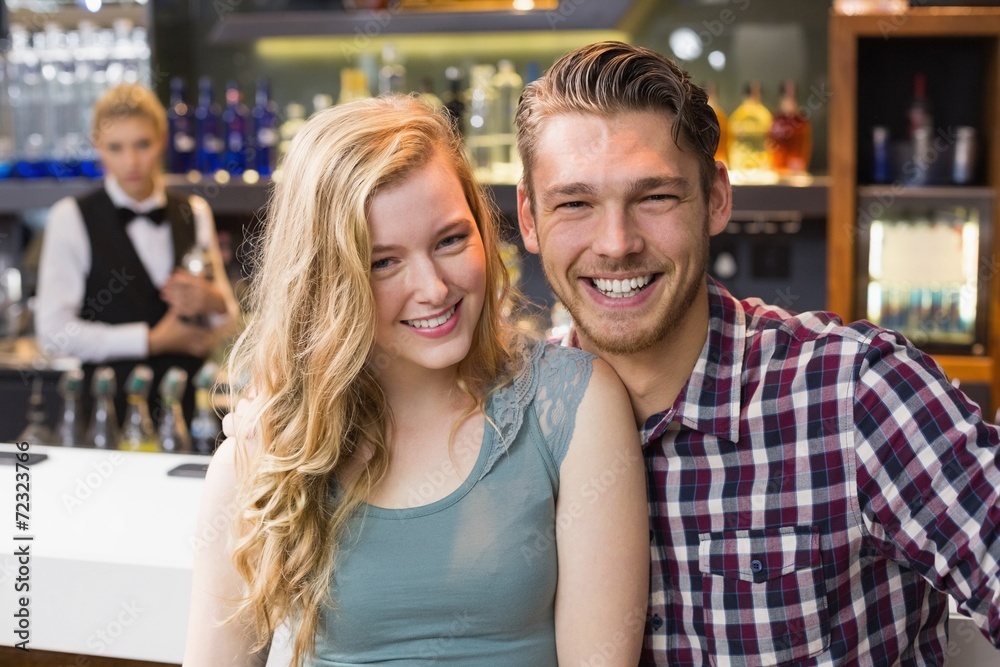 Young couple smiling at the camera Young couple smiling at the camera