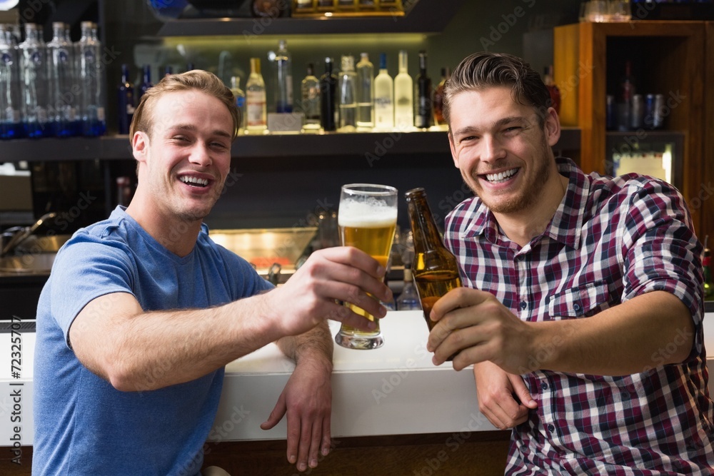 Young men drinking beer together