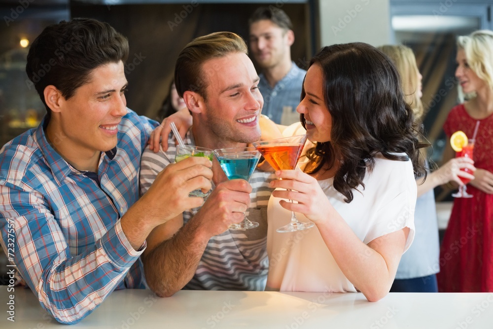 Young friends having a drink together Young friends having a drink together