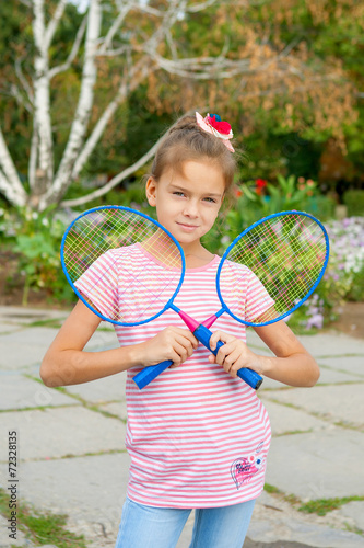 Cute girl with racket Outdoors