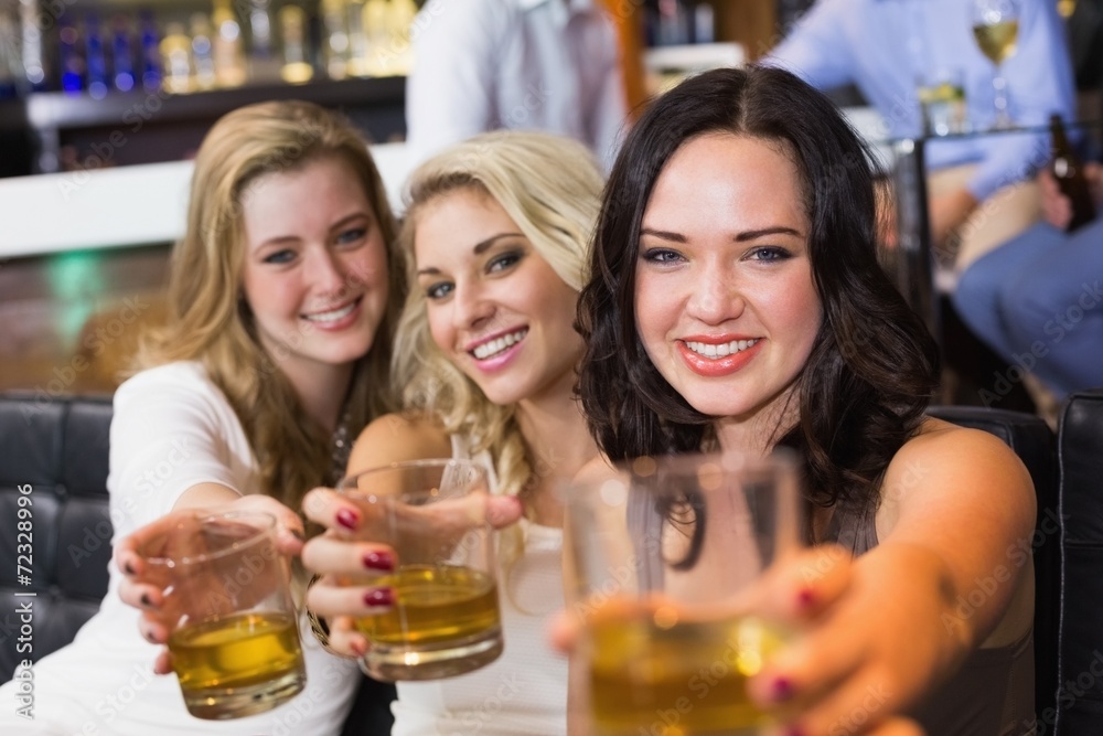 Pretty friends having a drink together