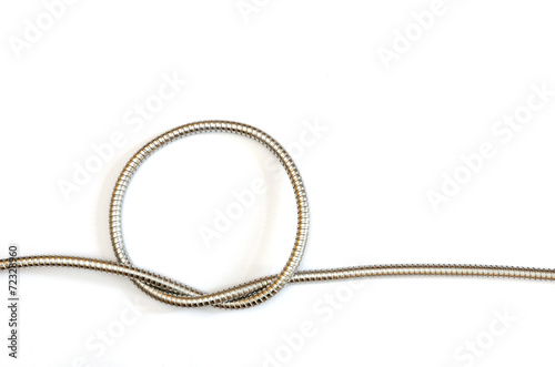 a circle shape formed by a flexible metal hose