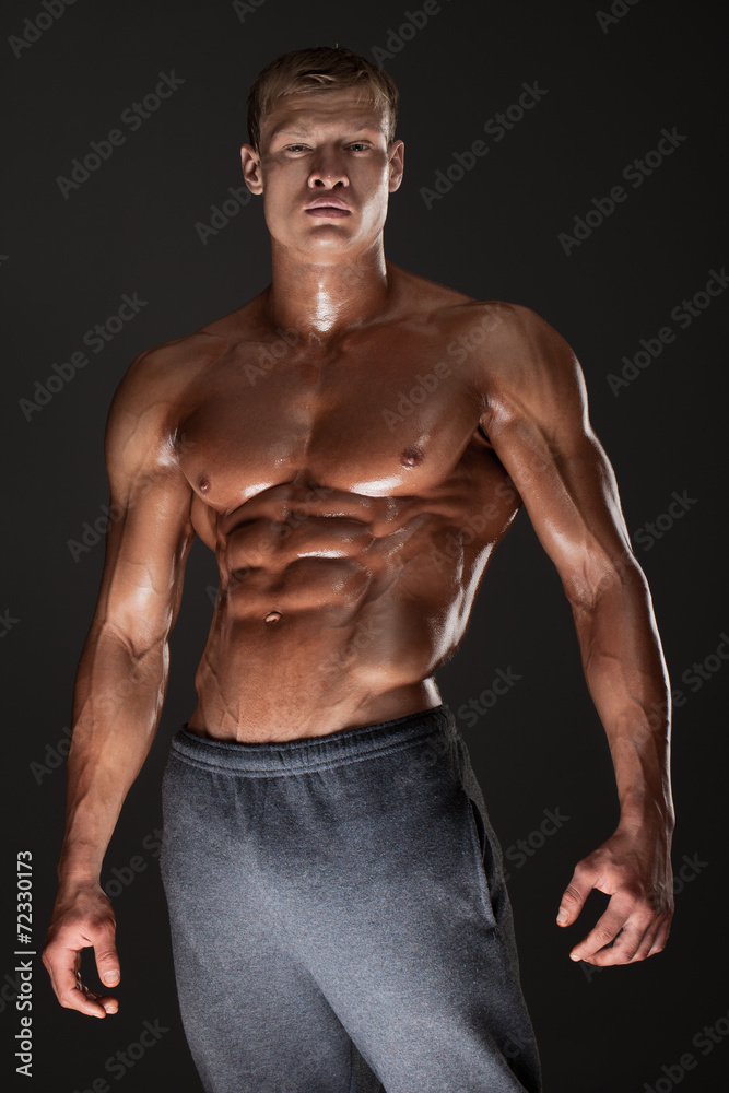 Fototapeta premium Muscled male model in studio
