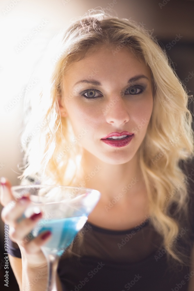 Attractive blonde drinking a cocktail Attractive blonde drinking a cocktail