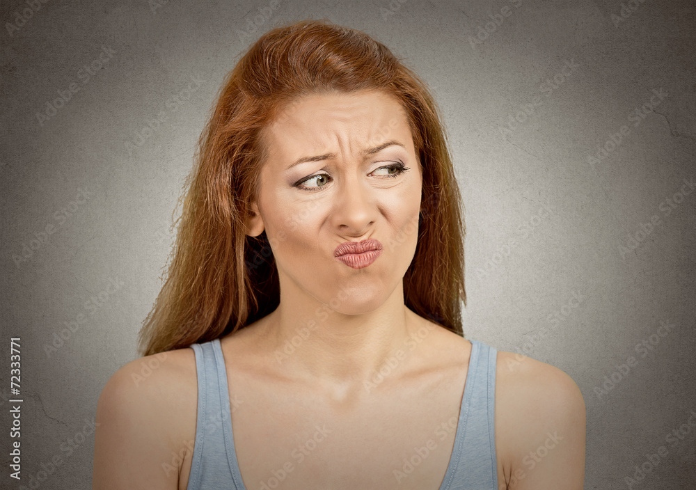 Upset disgusted woman with displeased face expression Upset disgusted woman with displeased face expression