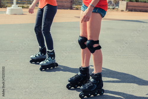 Two women rollerblading