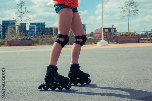 Woman rollerblading on sunny day