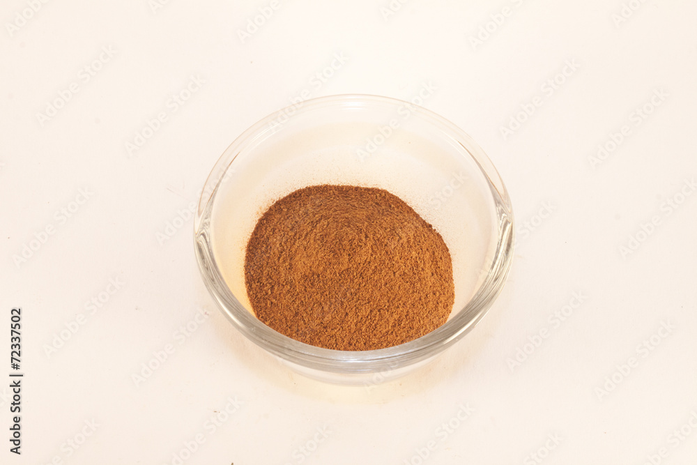 Cinnamon powder, in a glas pot Cinnamon powder, in a glas pot