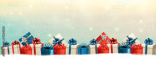 Holiday Christmas background with a border of gift boxes. Vector
