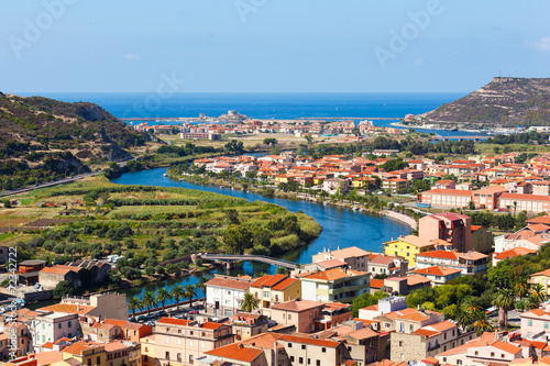 Colorful river and houses with red roofs photo