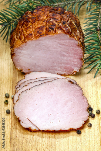 Sliced ham on wooden table