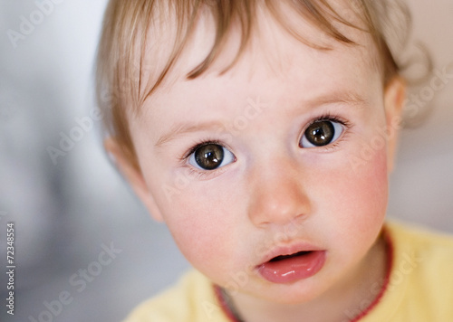 A little cute girl looking with an interest