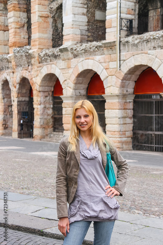 Attractive girl near the Arena of Verona - the place of annual f