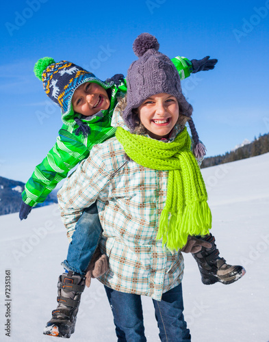 Happy kids playing winter photo