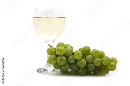 glass of wine and cluster of vine
