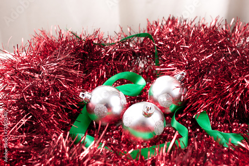 silver ornaments green ribbon and red garland