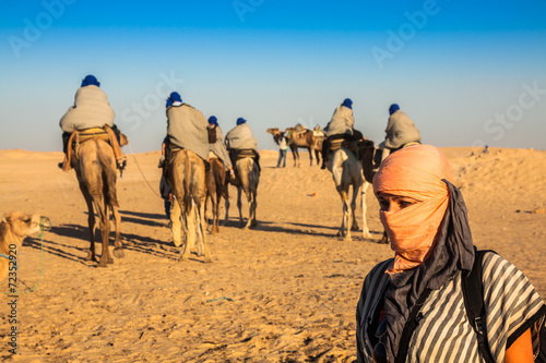 Beduins leading tourists on camels at short tourist tour around © Lukasz Janyst