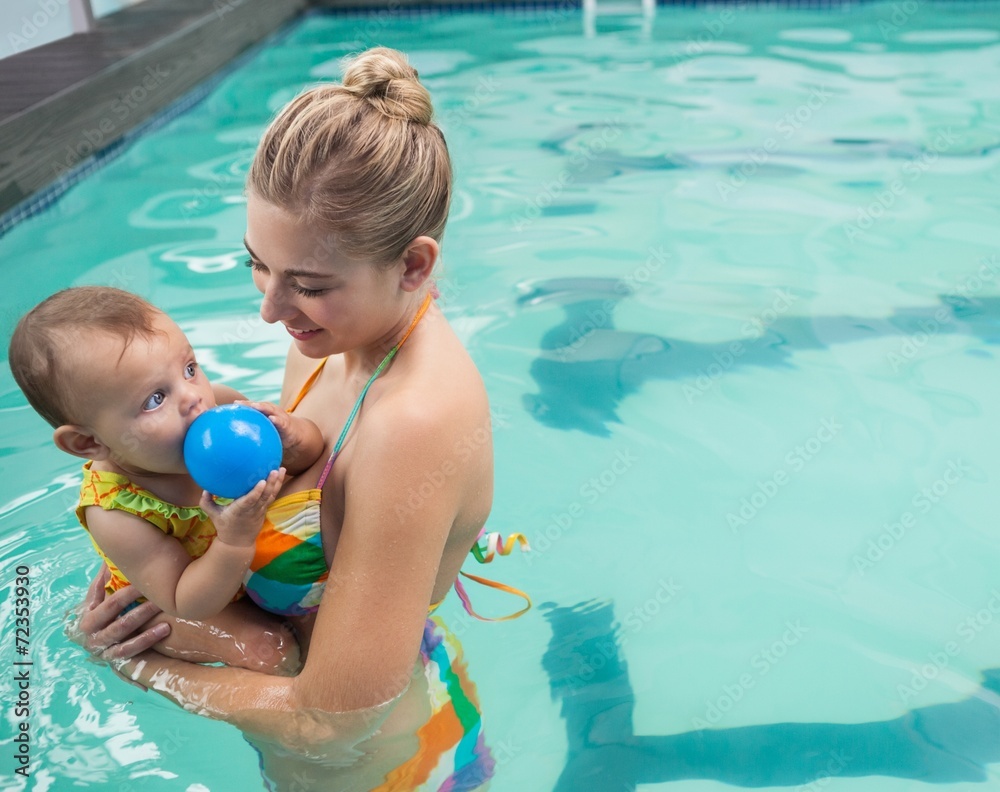Pretty mother and baby at the swimming pool Pretty mother and baby at the swimming pool