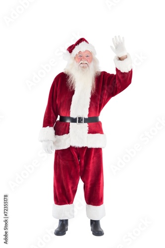 Jolly Santa waving at camera